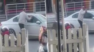 Otomobile kaldırım taşı ile saldırdı, camı kıramayınca uzaklaştı